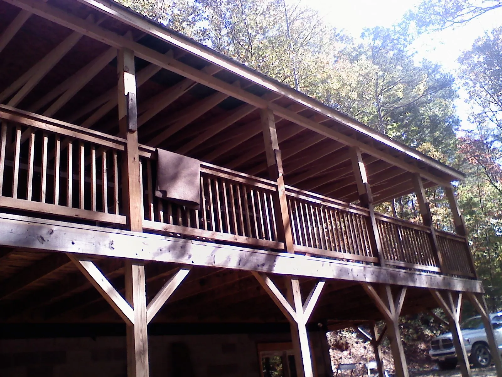 Timber framing under a new elevated porch and deck — Roof Leak Repair in Swan Valley by Roofing Brothers